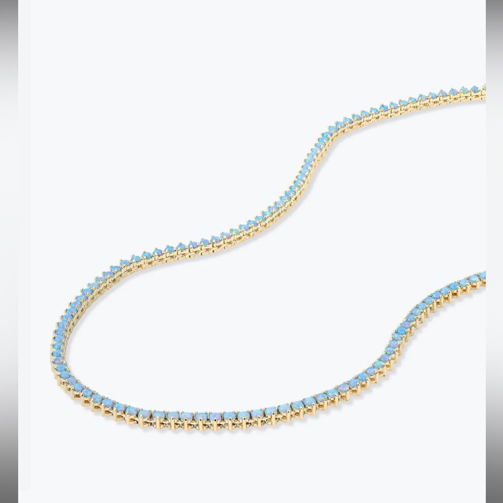 Melinda Maria not your basic tennis necklace 
Gold blue opal 16”